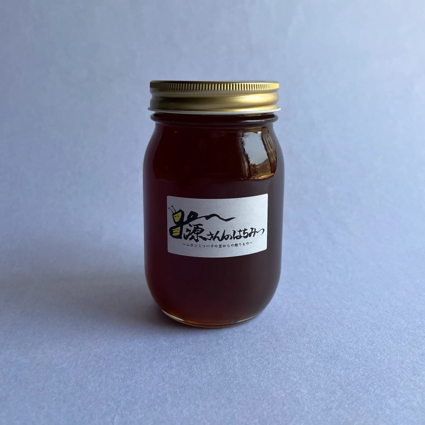 ニホンミツバチの生蜂蜜・深茶色(ガラス瓶 600g)